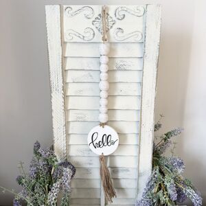 Hello Hanging Bead Garland With Tassel and Stamped Disc Hanger Sign Distressed